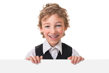 Image showing Little boy is peeking from blank sign