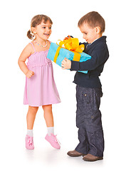Image showing Little boy  giving a gift box to her girlfriend