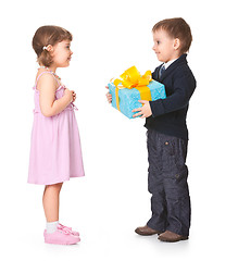 Image showing Little boy  giving a gift box to her girlfriend