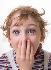 Image showing curly-haired boy surprised