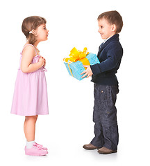 Image showing Little boy  giving a gift box to her girlfriend