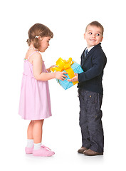 Image showing Little boy  giving a gift box to her girlfriend