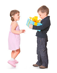 Image showing Little boy  giving a gift box to her girlfriend