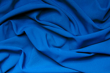 Image showing The folds of a bright blue cloth. Abstract Background