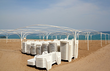 Image showing Empty beach with sun lounger