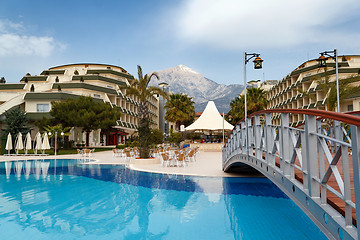 Image showing luxury hotels exterior with pool and small bridge