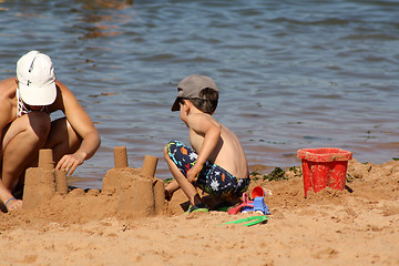 Image showing mother and child building sand castle