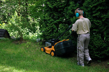 Image showing Working in garden