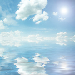 Image showing sun, blue sky, and ocean of clouds  