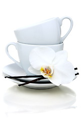 Image showing Two teacups, vanilla and flower. teacups, vanilla and flower.