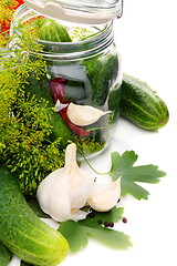 Image showing Cucumbers and spices for pickling.