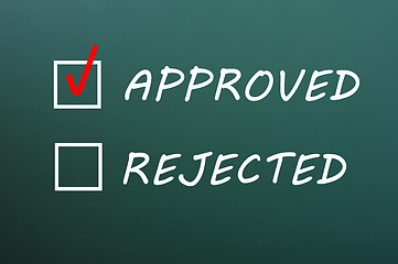 Image showing Check boxes for approved and rejected on a green chalkboard 