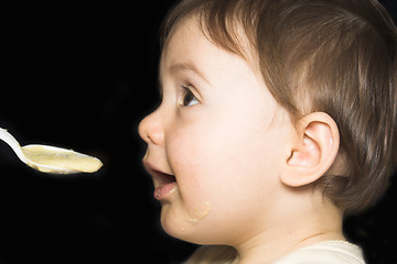 Image showing baby being fed with spoon