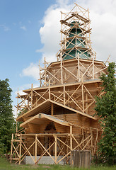 Image showing Construction of rural wooden church. Russia