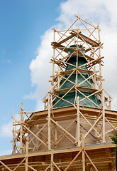 Image showing Erection of the tent a wooden church