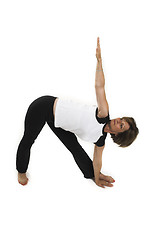 Image showing woman doing yoga pose over white BG