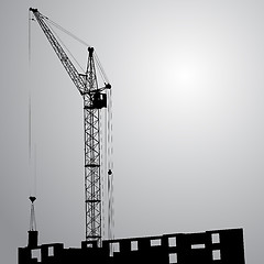 Image showing Silhouette of one cranes working on the building 