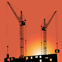 Image showing Silhouettes of crane on building against 