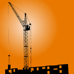 Image showing Silhouette of crane on a sunset on a building