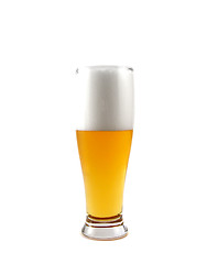 Image showing Beer into glass isolated on white