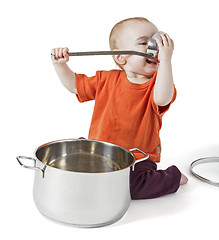 Image showing baby with big cooking pot