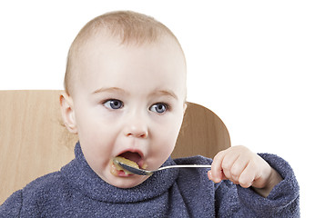 Image showing baby eating applesauce