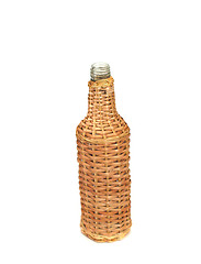 Image showing Empty transparent bottle in wood, on white