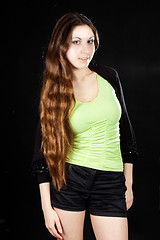 Image showing beautiful girl posing on black background