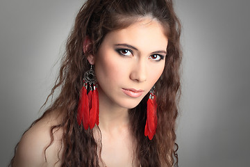 Image showing cute girl with beautiful red earrings