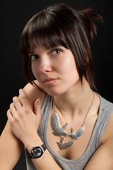 Image showing Portrait of brunette girl on dark background