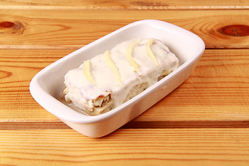 Image showing white lasagna isolated on wooden background