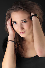 Image showing beautiful young girl smiling, on gray background