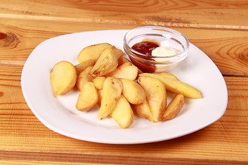 Image showing coocked potatot with ketchup isolated