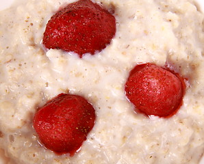 Image showing Fresh strawberries in porridge