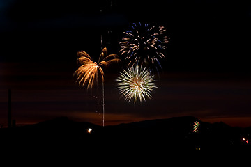 Image showing Firecrackers In The Sky During Sunset