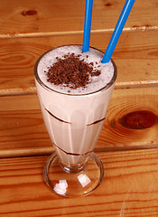 Image showing Milk cocktail and straw in goblet with chocolate