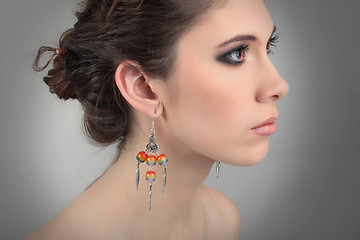 Image showing profil of a naked girl with beautiful earrings