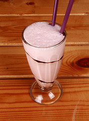 Image showing milkshake on wooden background