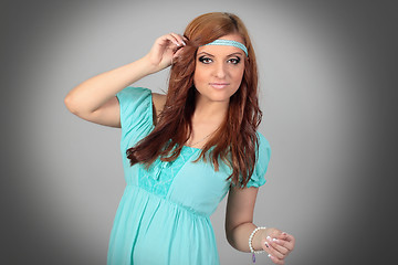 Image showing Beautiful young woman in blue dress. Isolated