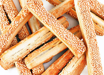 Image showing appetizing baking sticks with sesame