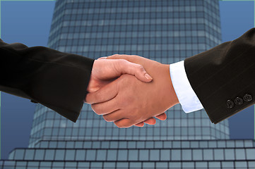 Image showing Hand shake between a businessman and a businesswoman