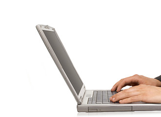 Image showing Businessman typing on a notebook