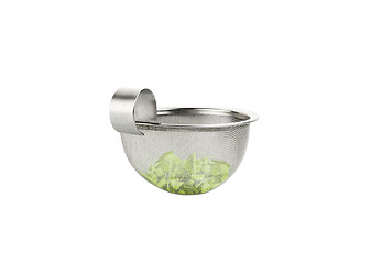 Image showing Tea strainer loaded with green tea