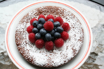 Image showing Chocolate gateau with berries