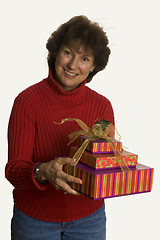 Image showing happy woman with gifts stack