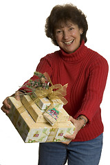 Image showing happy woman with gifts stack