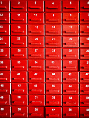 Image showing Numbered red wooden cases