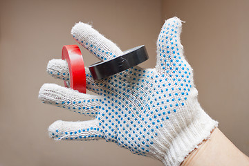 Image showing Two ringlet tape in hand