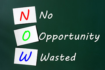 Image showing Acronym of NOW - No Opportunity Wasted on a chalkboard 