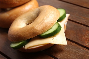 Image showing fresh cheese and ham bagel 